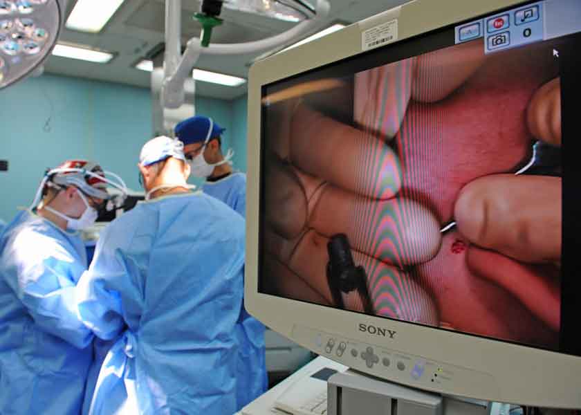 Surgeons operating during surgery