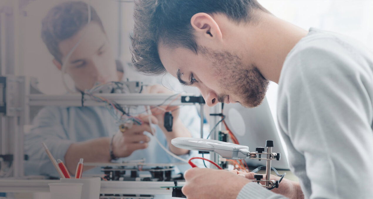 Students wiring components - Engineering summer school